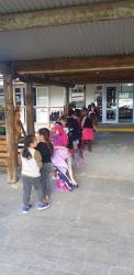 Room 11 students lining up outside their classroom showing POWER to the other classes