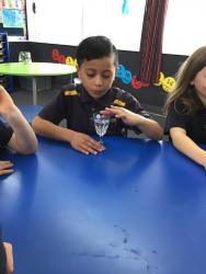 Room 4 Making sounds on the crystal glass2. Te Ramaroa concentrating on creating sound. 2